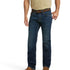 A man wearing Ariat M5 Stretch Remming Stackable Straight Leg Mens Jeans and a brown belt with jeans pockets and Anchored belt loops visible.